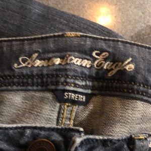 American Eagle size 6 Long Stretch Boot Cut Jeans crotch is 6”. Length is 32”.